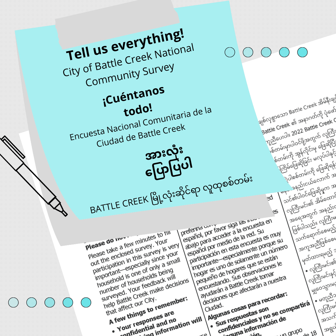 Gray background with blue sticky note promoting city survey in English, Spanish and Burmese