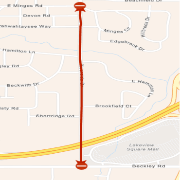 A city street map showing the temporary closure of Riverside Drive as a red line.