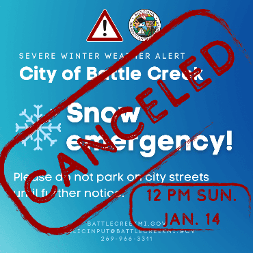 Blue snow emergency graphic with canceled across it in red