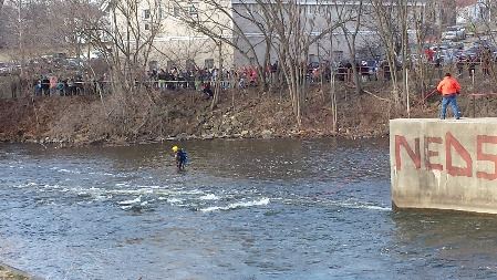 Vehicle being pulled from river