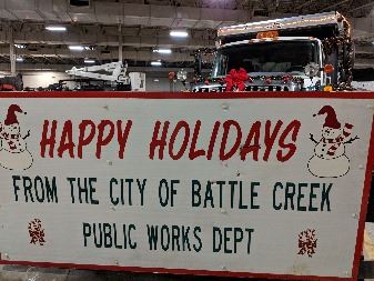 Plow truck Happy Holidays sign
