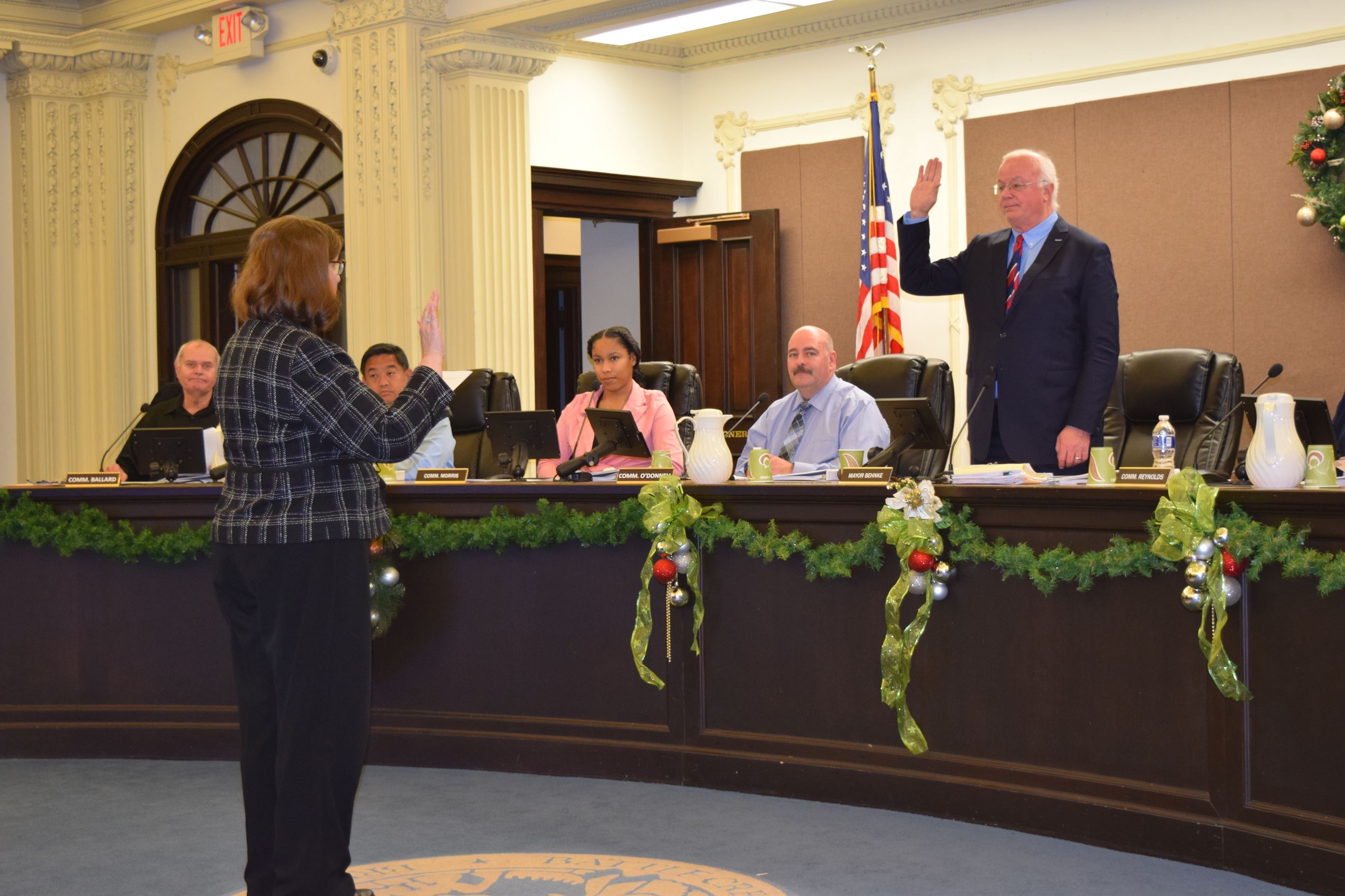 City Clerk Victoria Houser administers the oath of office to Mayor Mark Behnke.